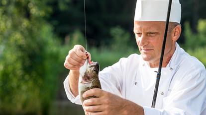 A chef with a fish
